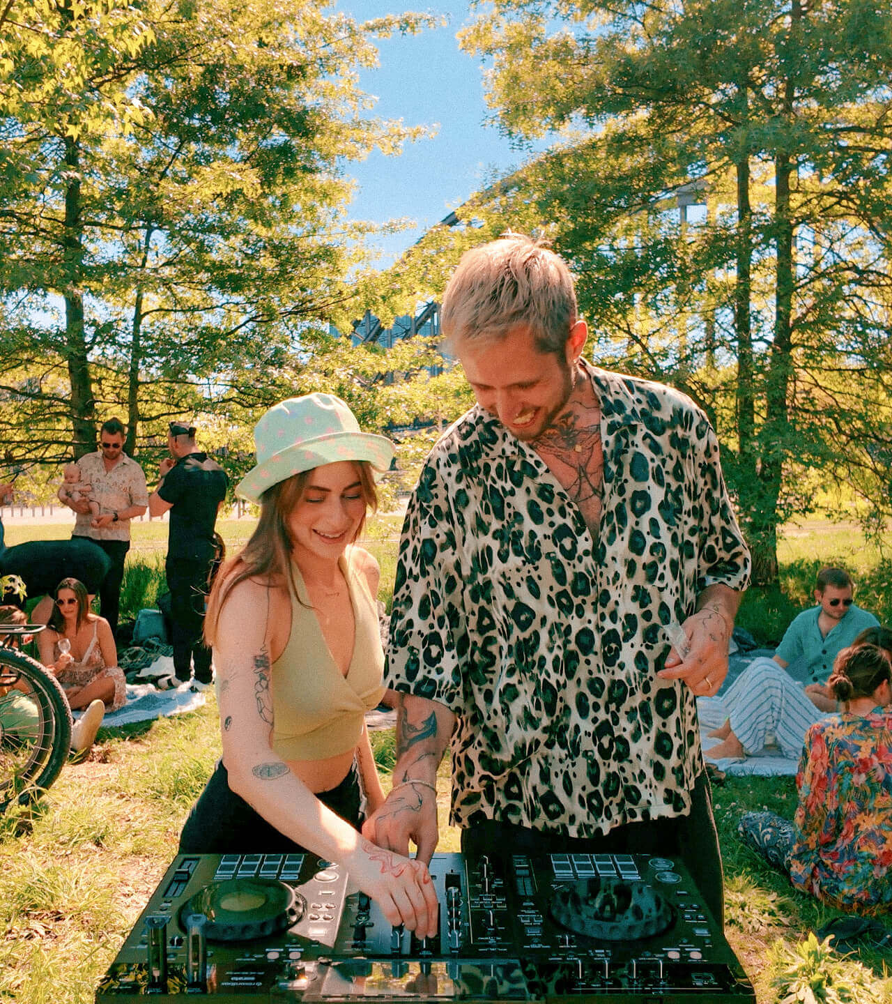 DJ Duo kitsch and SASH playing a groovy house set in a park for YouTube